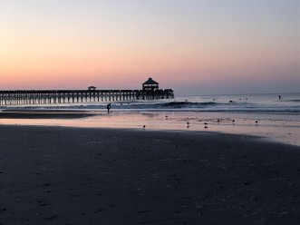 The sun rising over the Folly Beach shorline. Photo by: Gabe Perez